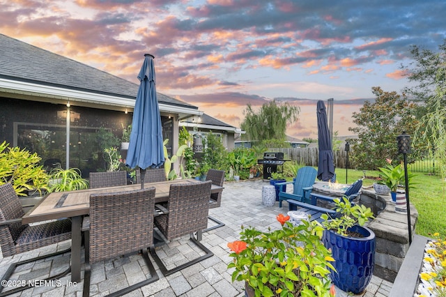 338 Deerfield Glen Dr, Saint Augustine, FL 32086 - patio terrace at dusk with a patio, a grill, and outdoor dining area