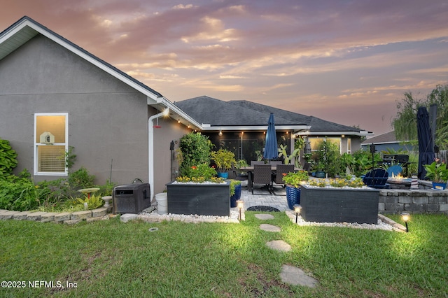 338 Deerfield Glen Dr, Saint Augustine, FL 32086 - rear view of property featuring a patio area, stucco siding, and a yard