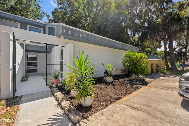 1206 Mayport Landing Cir, Jacksonville, FL 32233 - view of property exterior with stucco siding