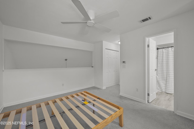1206 Mayport Landing Cir, Jacksonville, FL 32233 - unfurnished bedroom featuring carpet floors, connected bathroom, a closet, and a ceiling fan