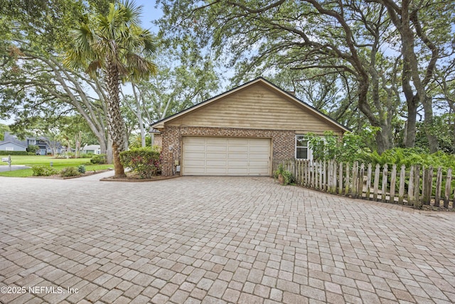521 Birch Ct, Neptune Beach, FL 32266 - garage with decorative driveway