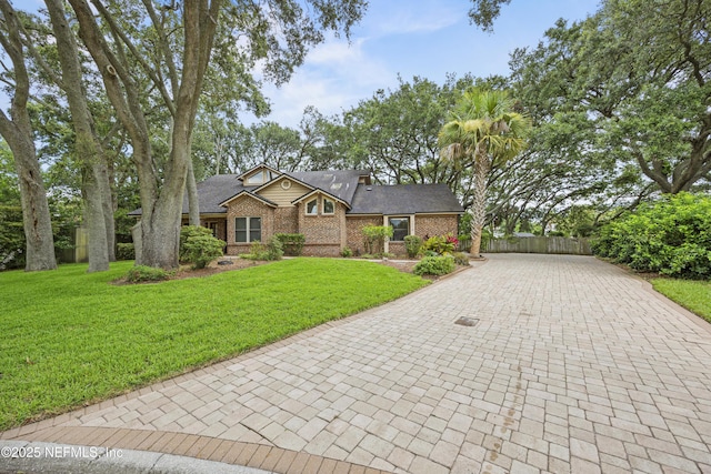 521 Birch Ct, Neptune Beach, FL 32266 - view of front of house featuring brick siding and decorative driveway