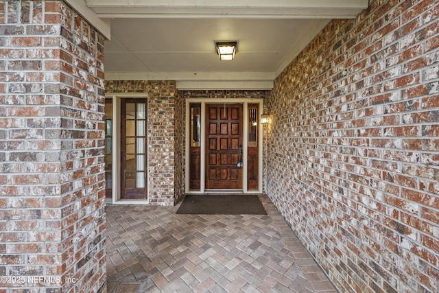 521 Birch Ct, Neptune Beach, FL 32266 - view of exterior entry featuring brick siding
