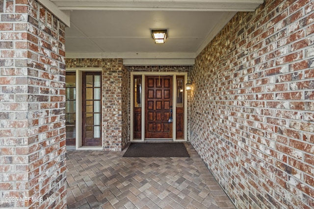 521 Birch Ct, Neptune Beach, FL 32266 - view of exterior entry featuring brick siding