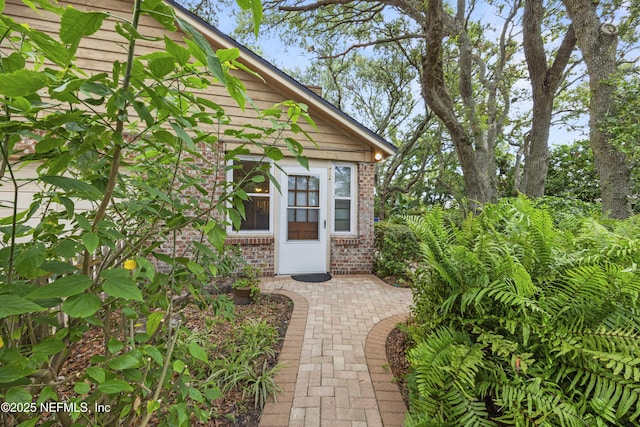 521 Birch Ct, Neptune Beach, FL 32266 - doorway to property featuring brick siding