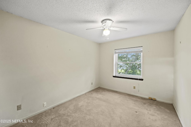 521 Birch Ct, Neptune Beach, FL 32266 - unfurnished room featuring light carpet, ceiling fan, and a textured ceiling