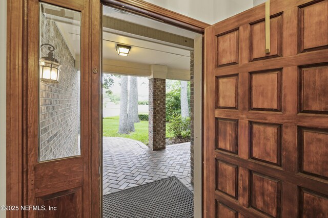 521 Birch Ct, Neptune Beach, FL 32266 - entryway featuring brick patterned flooring