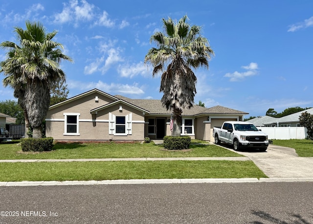 86111 Cartesian Pointe Dr, Yulee, FL 32097 - ranch-style home with driveway, an attached garage, and stucco siding