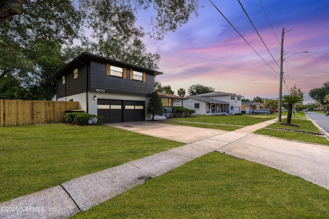 1900 Dalamon St, Jacksonville, FL 32211 - view of front of house with a garage, driveway, and brick siding