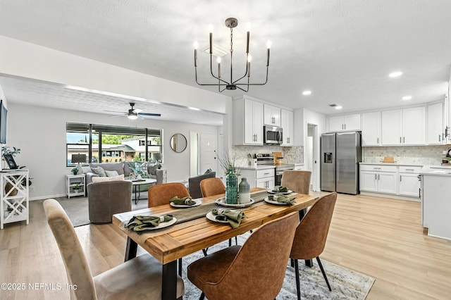 1900 Dalamon St, Jacksonville, FL 32211 - dining room featuring light wood-type flooring, a chandelier, a ceiling fan, and recessed lighting
