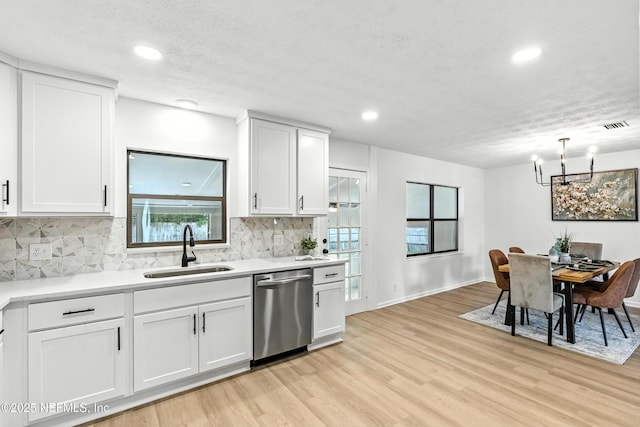 1900 Dalamon St, Jacksonville, FL 32211 - kitchen with dishwasher, a chandelier, light wood-type flooring, light countertops, and recessed lighting