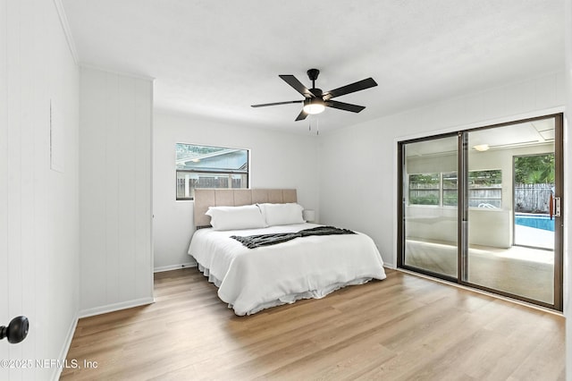 1900 Dalamon St, Jacksonville, FL 32211 - bedroom with access to exterior, wood finished floors, and ceiling fan