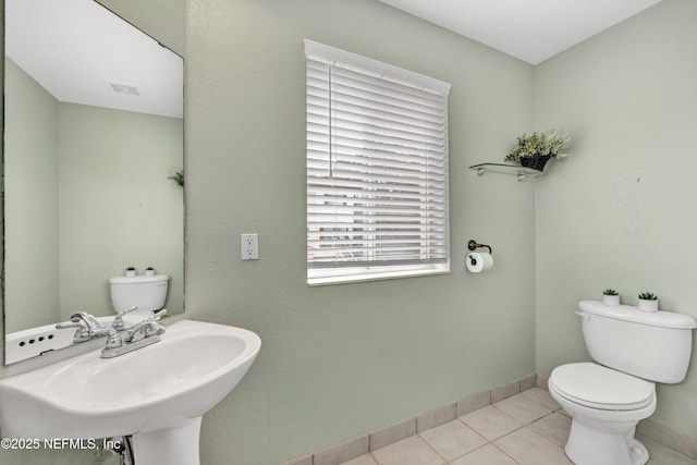 9745 Touchton Rd Unit 121, Jacksonville, FL 32246 - bathroom featuring toilet and tile patterned floors