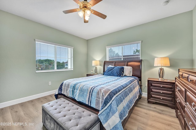 9745 Touchton Rd Unit 121, Jacksonville, FL 32246 - bedroom with multiple windows, light wood-style floors, and ceiling fan