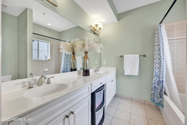 9745 Touchton Rd Unit 121, Jacksonville, FL 32246 - full bath featuring double vanity, tile patterned floors, and shower / tub combo