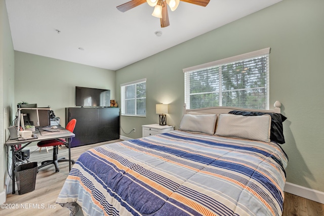 9745 Touchton Rd Unit 121, Jacksonville, FL 32246 - bedroom with light wood-type flooring, a desk, and ceiling fan