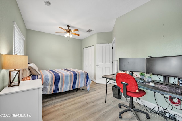 9745 Touchton Rd Unit 121, Jacksonville, FL 32246 - bedroom featuring light wood-style flooring, an office area, a closet, and ceiling fan