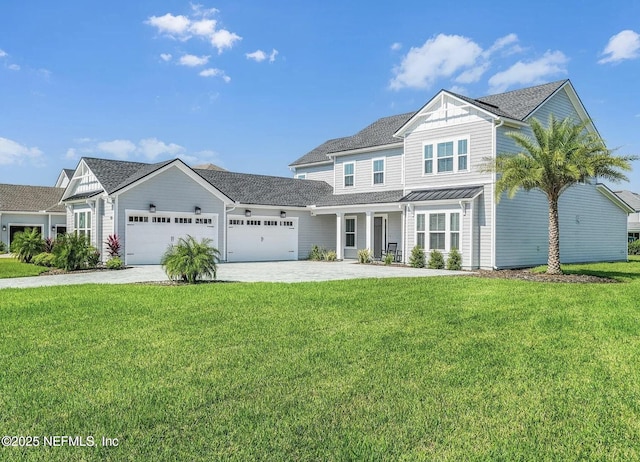 32 Awlleaf Ct, Saint Augustine, FL 32095 - view of front facade with a garage, driveway, a front yard, a porch, and a standing seam roof