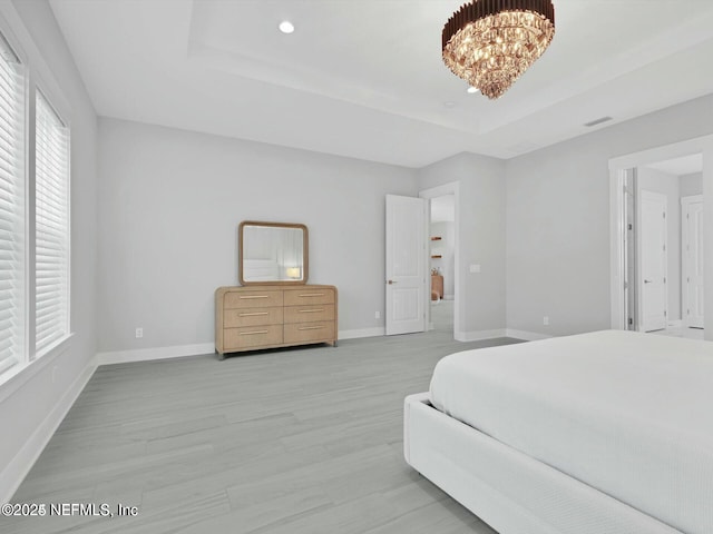 32 Awlleaf Ct, Saint Augustine, FL 32095 - bedroom with a raised ceiling, light wood-type flooring, a chandelier, and recessed lighting