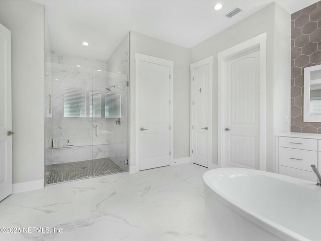 32 Awlleaf Ct, Saint Augustine, FL 32095 - bathroom featuring a freestanding tub, a marble finish shower, recessed lighting, and marble finish floors