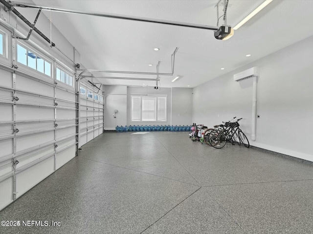32 Awlleaf Ct, Saint Augustine, FL 32095 - garage with a garage door opener, a wall unit AC, and recessed lighting