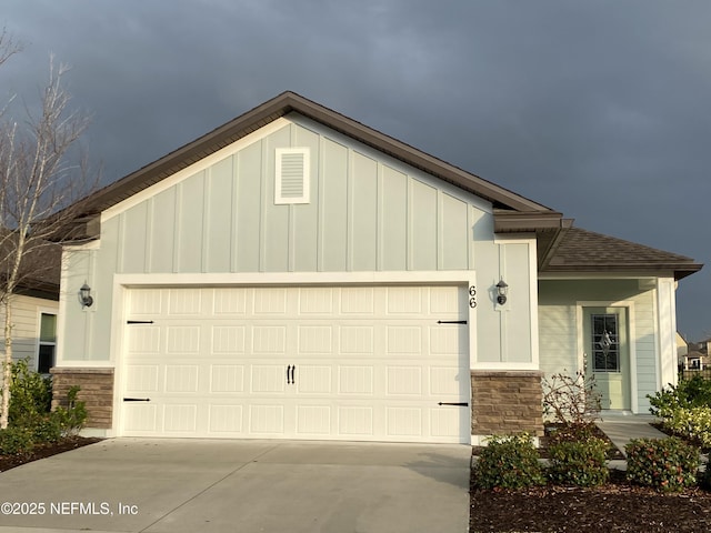 66 Tree Frog Way, Saint Augustine, FL 32095 - view of front of home featuring stone siding, concrete driveway, and board and batten siding