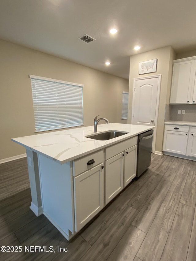 66 Tree Frog Way, Saint Augustine, FL 32095 - kitchen featuring stainless steel dishwasher, white cabinets, dark wood-type flooring, a center island with sink, and recessed lighting