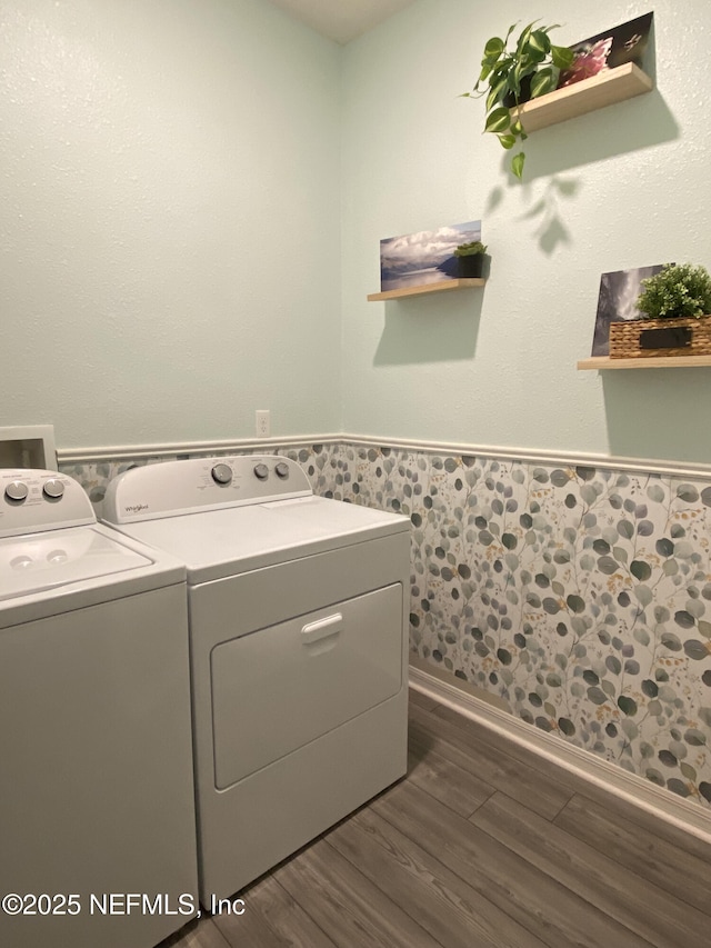 66 Tree Frog Way, Saint Augustine, FL 32095 - laundry area featuring separate washer and dryer, a wainscoted wall, and dark wood-style floors