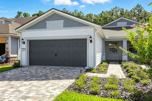 81 Glenhurst Ave, Ponte Vedra, FL 32081 - view of front of house with decorative driveway, an attached garage, and roof with shingles
