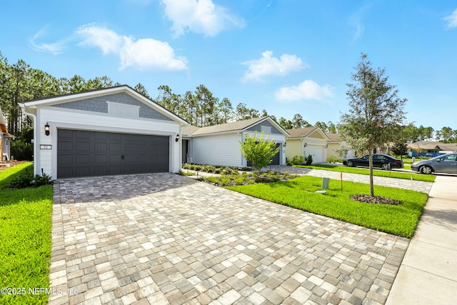 81 Glenhurst Ave, Ponte Vedra, FL 32081 - view of front of property with decorative driveway, a front lawn, and a garage
