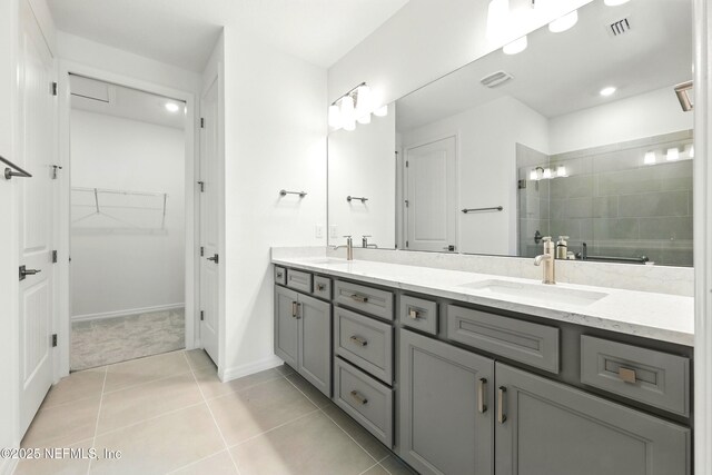 81 Glenhurst Ave, Ponte Vedra, FL 32081 - full bathroom featuring double vanity, a stall shower, tile patterned flooring, a walk in closet, and recessed lighting