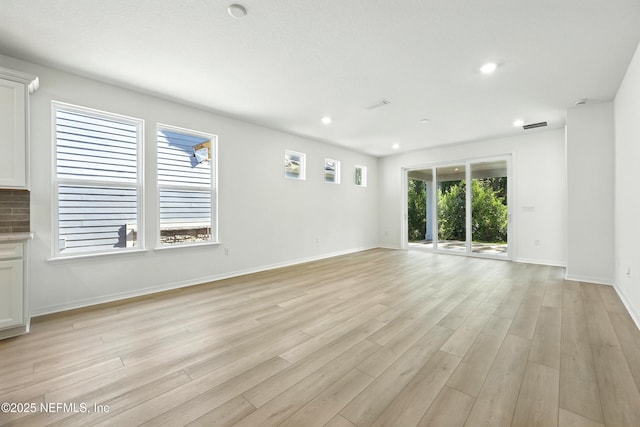 81 Glenhurst Ave, Ponte Vedra, FL 32081 - unfurnished living room with light wood-style floors and recessed lighting