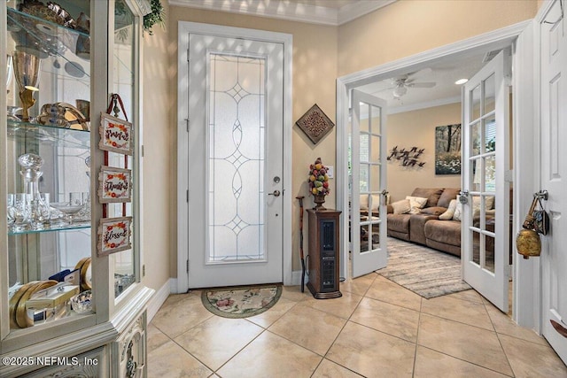 11725 Surfbird Cir Unit 4C, Jacksonville, FL 32256 - foyer with french doors, crown molding, ceiling fan, and light tile patterned floors