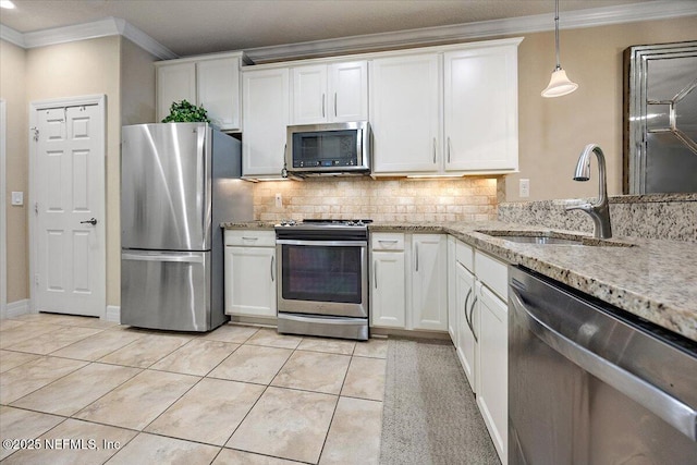 11725 Surfbird Cir Unit 4C, Jacksonville, FL 32256 - kitchen with stainless steel appliances, ornamental molding, backsplash, and white cabinets