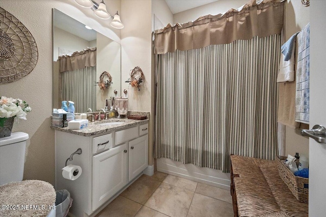 11725 Surfbird Cir Unit 4C, Jacksonville, FL 32256 - bathroom with vanity, tile patterned floors, shower / tub combo with curtain, and a textured wall