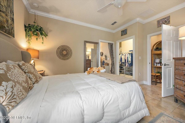11725 Surfbird Cir Unit 4C, Jacksonville, FL 32256 - bedroom with crown molding, a spacious closet, a closet, a ceiling fan, and light tile patterned floors