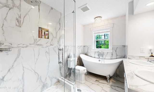 3793 Forest Dr, Middleburg, FL 32068 - bathroom with a marble finish shower, marble tiled flooring, a soaking tub, wainscoting, and tile walls