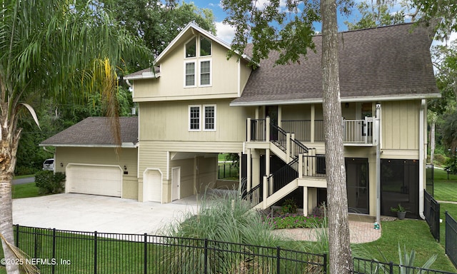 3793 Forest Dr, Middleburg, FL 32068 - view of front facade featuring roof with shingles, concrete driveway, stairs, and a garage
