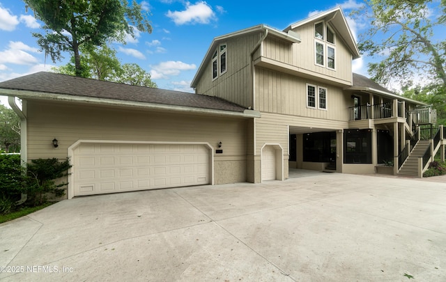 3793 Forest Dr, Middleburg, FL 32068 - view of property exterior featuring driveway, stairs, a garage, and a shingled roof