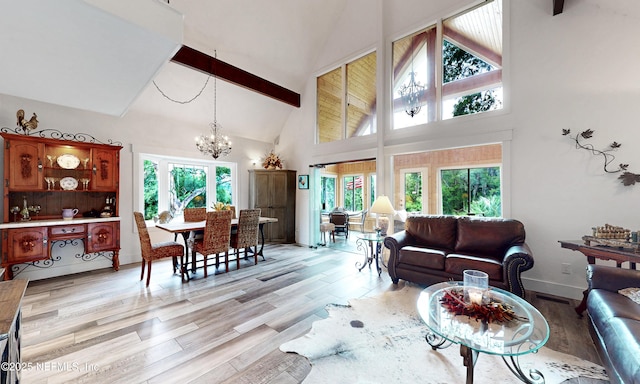 3793 Forest Dr, Middleburg, FL 32068 - living room with high vaulted ceiling, a chandelier, light wood-type flooring, and beam ceiling