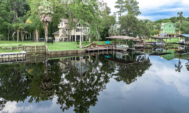 3793 Forest Dr, Middleburg, FL 32068 - dock area with a water view, boat lift, a lawn, and view of wooded area