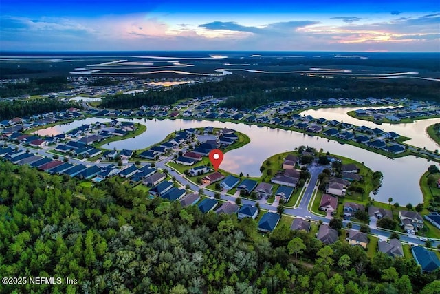 85212 Champlain Dr, Fernandina Beach, FL 32034 - aerial view of property and surrounding area featuring a large body of water and nearby suburban area