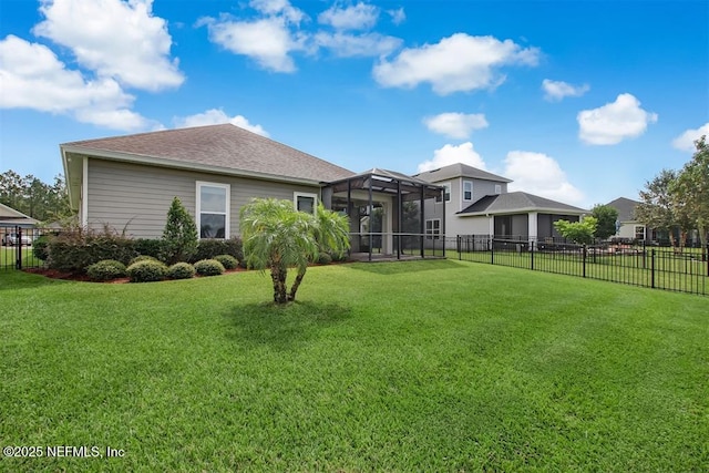 85212 Champlain Dr, Fernandina Beach, FL 32034 - back of property featuring a fenced backyard, a lanai, and a shingled roof