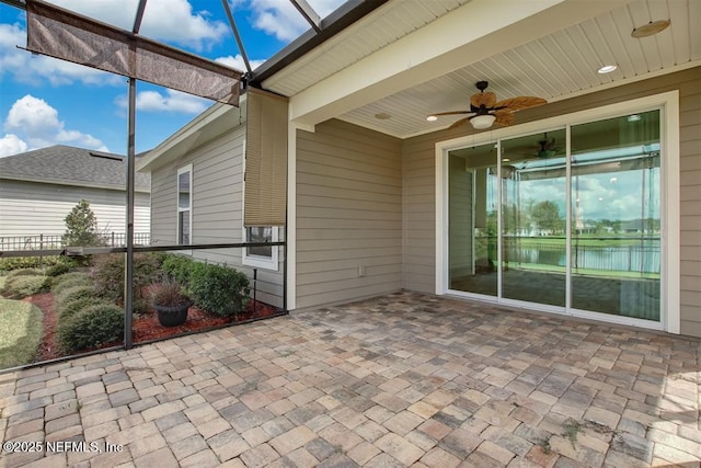 85212 Champlain Dr, Fernandina Beach, FL 32034 - unfurnished sunroom featuring ceiling fan, a water view, and healthy amount of natural light