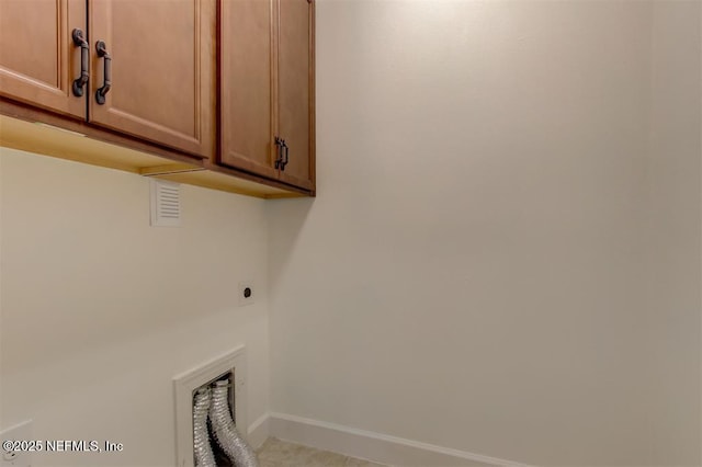 85212 Champlain Dr, Fernandina Beach, FL 32034 - washroom featuring electric dryer hookup and cabinet space