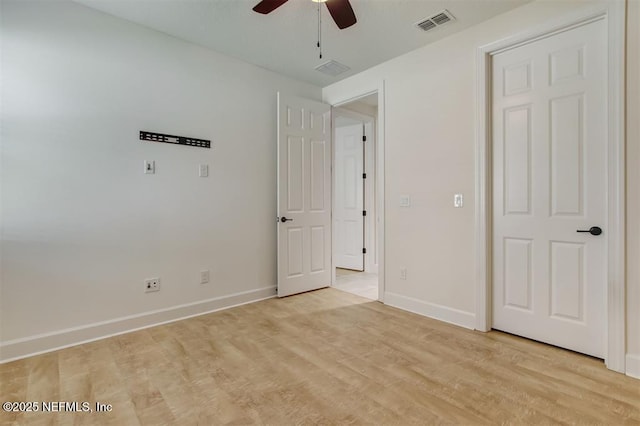 85212 Champlain Dr, Fernandina Beach, FL 32034 - unfurnished bedroom with light wood-type flooring and ceiling fan