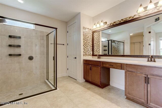 85212 Champlain Dr, Fernandina Beach, FL 32034 - full bath featuring a shower stall, double vanity, and tile patterned floors