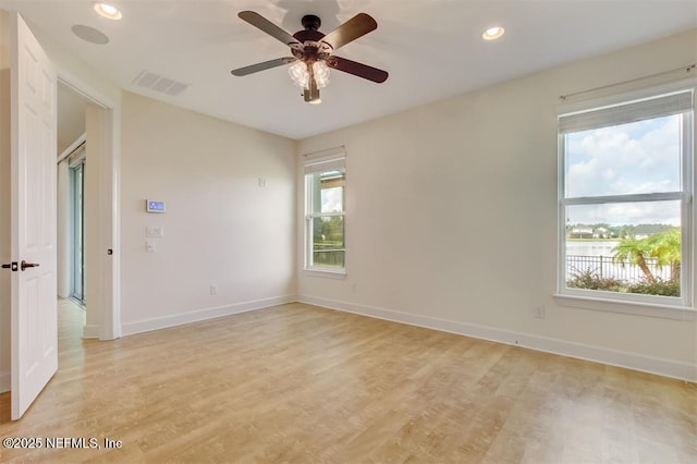 85212 Champlain Dr, Fernandina Beach, FL 32034 - unfurnished room with light wood finished floors, ceiling fan, recessed lighting, and a water view
