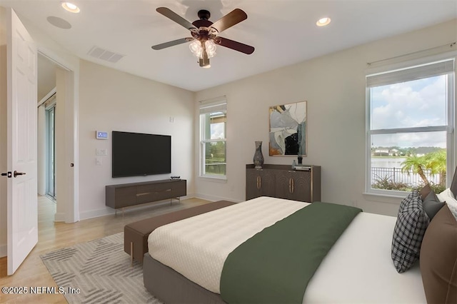85212 Champlain Dr, Fernandina Beach, FL 32034 - bedroom with recessed lighting, ceiling fan, and light wood finished floors