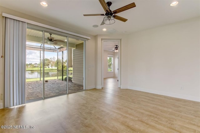 85212 Champlain Dr, Fernandina Beach, FL 32034 - unfurnished room with a water view, a ceiling fan, light wood-style flooring, and recessed lighting